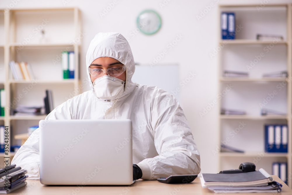 Office worker working in quarantine self-isolation Office worker working in quarantine self-isolation