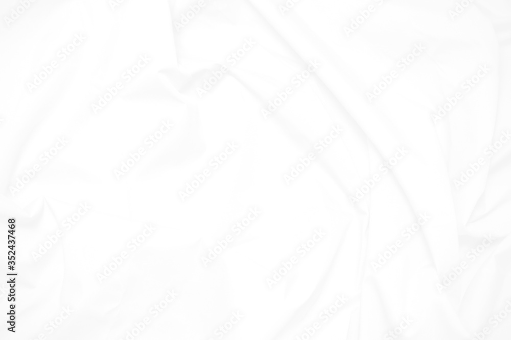 White fabric cloth background abstract with soft waves , flowing draped cloth in rippled elegant curves and wrinkled creases , soft focus, textured background and abstract White fabric cloth background abstract with soft waves , flowing draped cloth in rippled elegant curves and wrinkled creases , soft focus, textured background and abstract