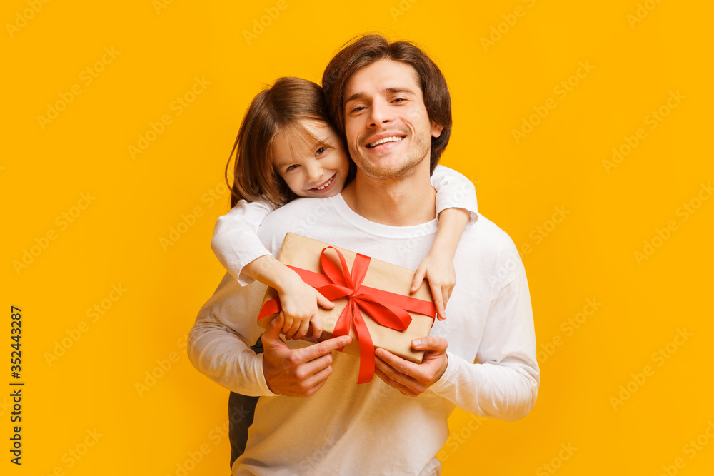 Little daughter and dad celebrating Father's Day Little daughter and dad celebrating Father's Day