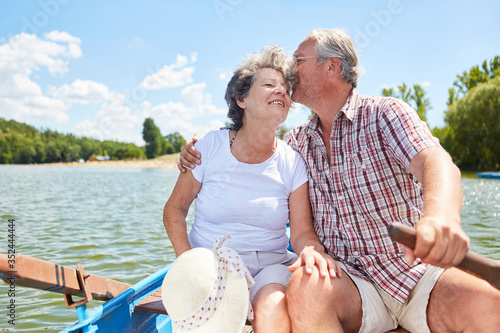 Amorous senior couple in the rowboat © Robert Kneschke