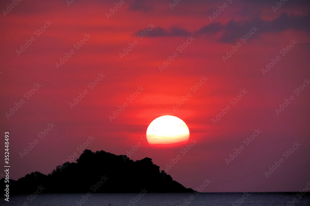 Obraz premium orange sky sunset black silhouettes of hills