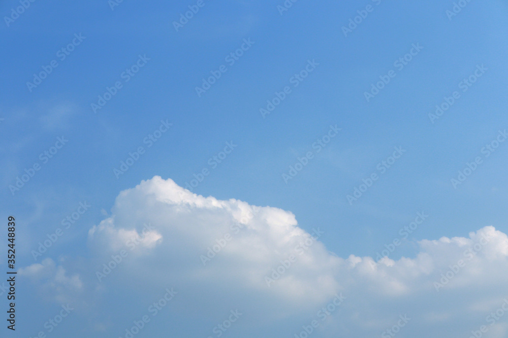 Clear blue sky background with white clouds Clear blue sky background with white clouds