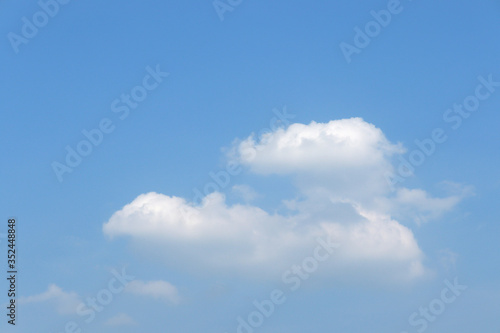 Fototapeta Naklejka Na Ścianę i Meble -  Clear blue sky background with white clouds