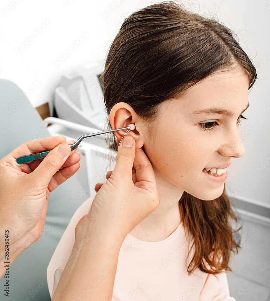 Process of making earplugs from an impression of an individual s child ear. Ear close-up. Personally molded earplugs. Part of the set