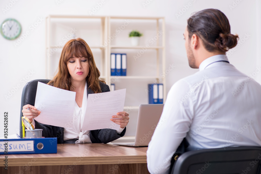 Business meeting between businessman and businesswoman Business meeting between businessman and businesswoman