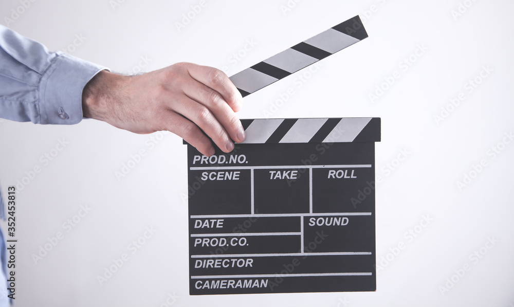 Fototapeta premium Man holding movie clapper. Making movie