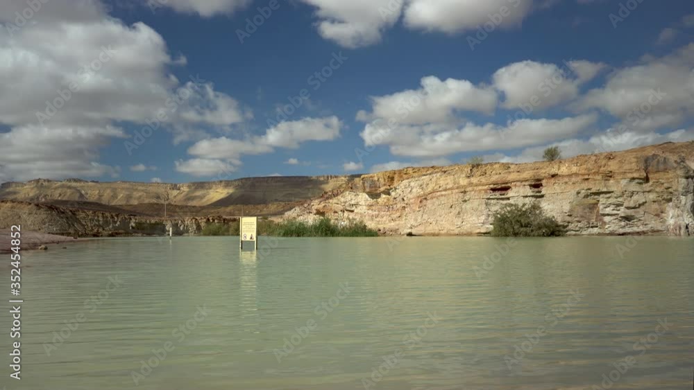 Water pond in Holot Tsivoniyim, Mitzpe Ramon Makhtesh crater, Negev Desert, Israel Water pond in Holot Tsivoniyim, Mitzpe Ramon Makhtesh crater, Negev Desert, Israel