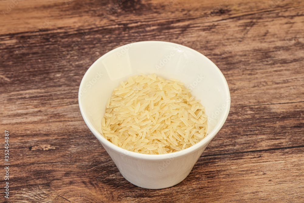 Raw basmati rice in the bowl Raw basmati rice in the bowl