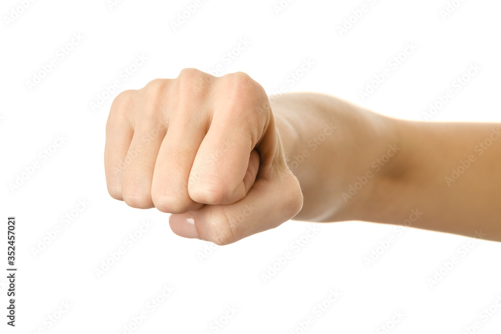 Hand clenched in a fist. Woman hand gesturing isolated on white Hand clenched in a fist. Woman hand gesturing isolated on white