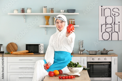 Housewife in protective cos...
