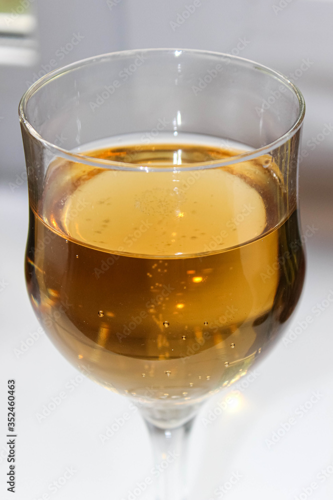 Yellow transparent drink wine or juice in a glass glass. Yellow transparent drink wine or juice in a glass glass.