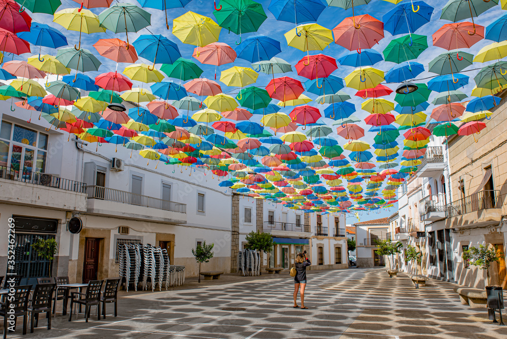 Umbrellas floating in the sky with lots of color in Águeda, Portugal
