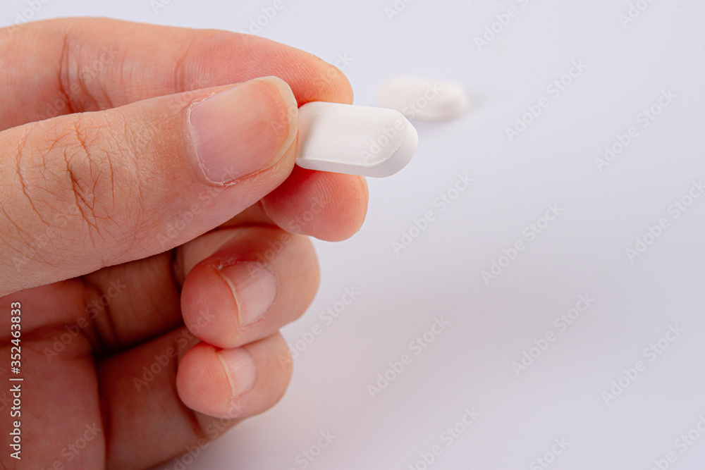 A hand hold the pills and drug, Pile of the drug and pills on the hand. A hand hold the pills and drug, Pile of the drug and pills on the hand.