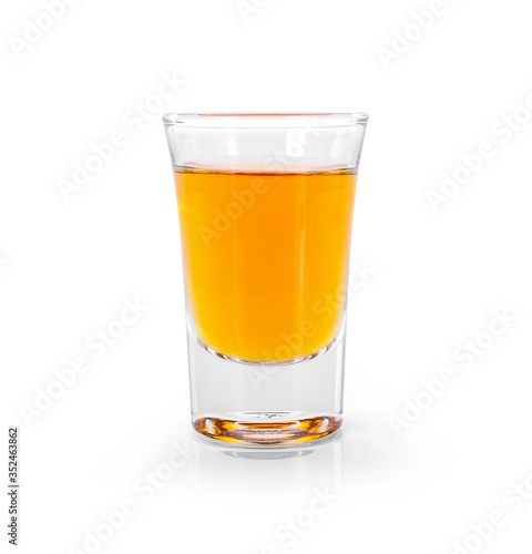 Glasses of whiskey and alcohol with ice isolated over white