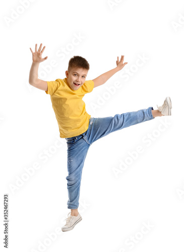 Cute dancing boy on white background