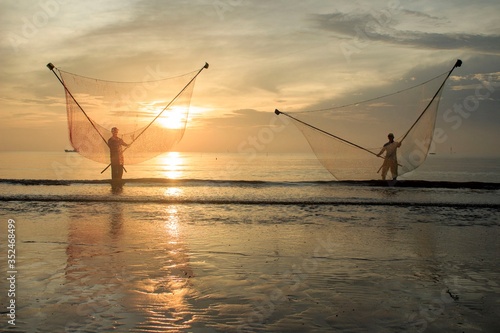 Artwork: fishermen catch fish by net