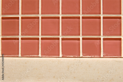 Red glass tile texture divided in half, background © Андрей Журавлев