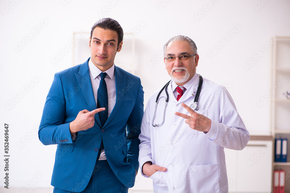 Young businessman meeting with old doctor Young businessman meeting with old doctor