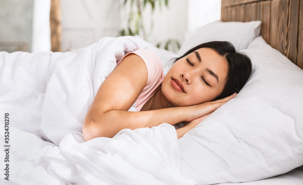 Asian Girl Sleeping Well Lying In Bed Resting At Home Asian Girl Sleeping Well Lying In Bed Resting At Home