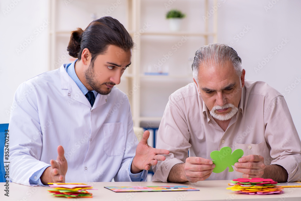 Doctor and patient suffering from Alzheimer disease Doctor and patient suffering from Alzheimer disease