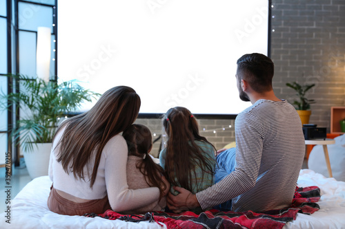 Young family watching movie...