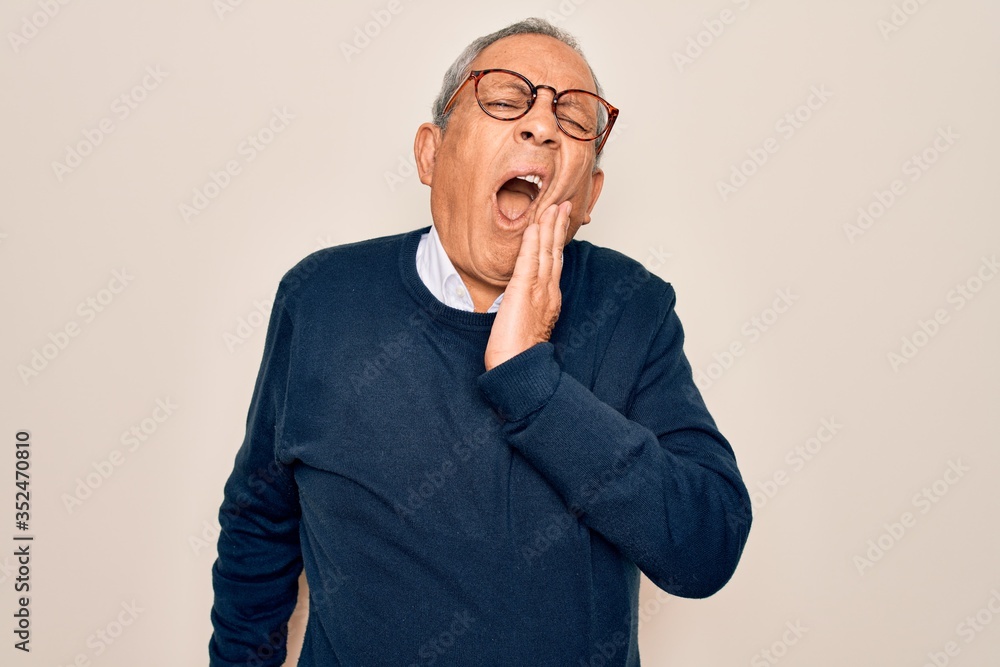 Senior handsome grey-haired man wearing sweater and glasses over isolated white background touching mouth with hand with painful expression because of toothache or dental illness on teeth. Dentist Senior handsome grey-haired man wearing sweater and glasses over isolated white background touching mouth with hand with painful expression because of toothache or dental illness on teeth. Dentist