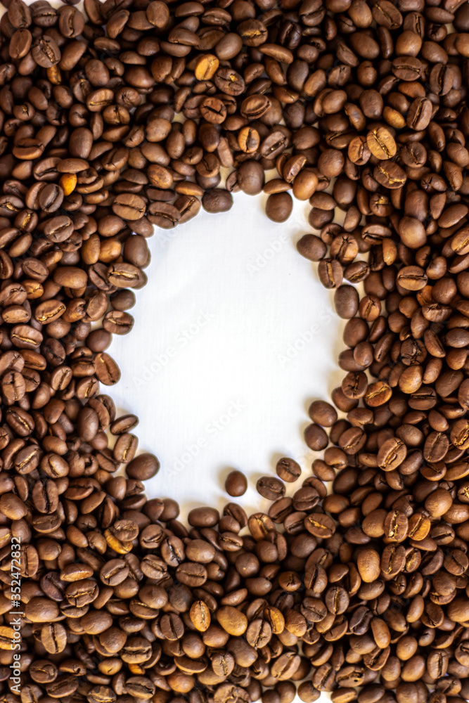 Coffee beans isolated on white background with place for text. Frame of coffee beans on white background. Closeup of coffee beans on plain paper. Coffee beans isolated on white background with place for text. Frame of coffee beans on white background. Closeup of coffee beans on plain paper.