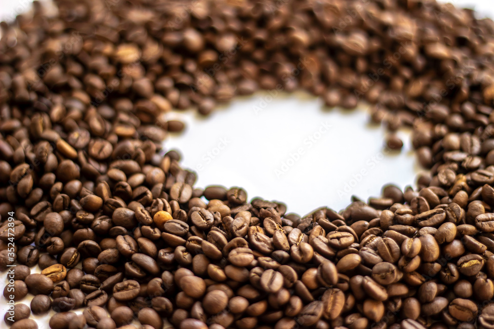 Coffee beans isolated on white background with place for text. Frame of coffee beans on white background. Closeup of coffee beans on plain paper. Coffee beans isolated on white background with place for text. Frame of coffee beans on white background. Closeup of coffee beans on plain paper.