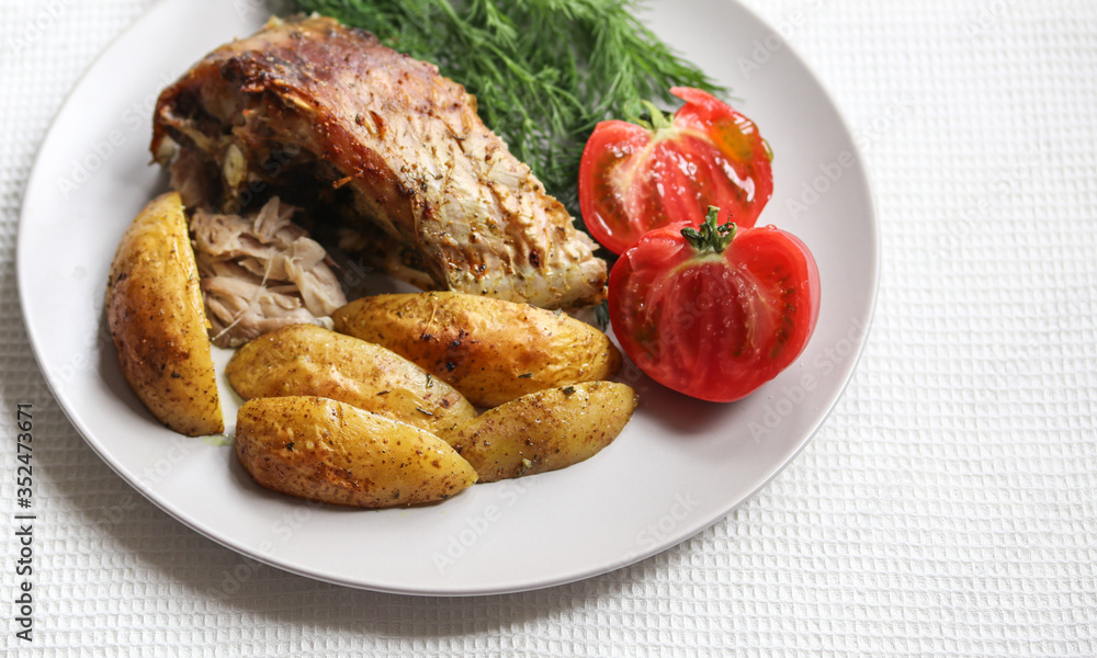 fried fish with vegetables on a plate fried fish with vegetables on a plate
