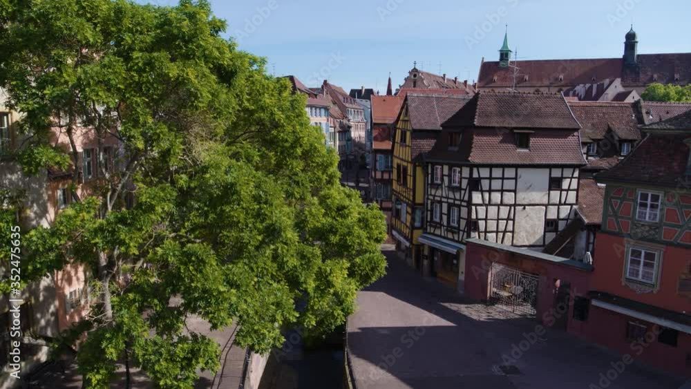 Aerial drone shot of the city of Colmar in Alsace France. Quiet street during summer with blue sky. Aerial drone shot of the city of Colmar in Alsace France. Quiet street during summer with blue sky.