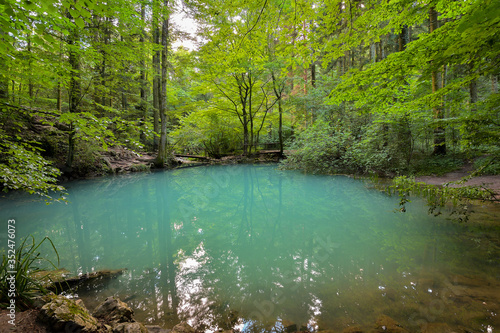 Ochiul Beiului, a small emerald lake on the Nera gorge in Beusnita National Park in Romania photo