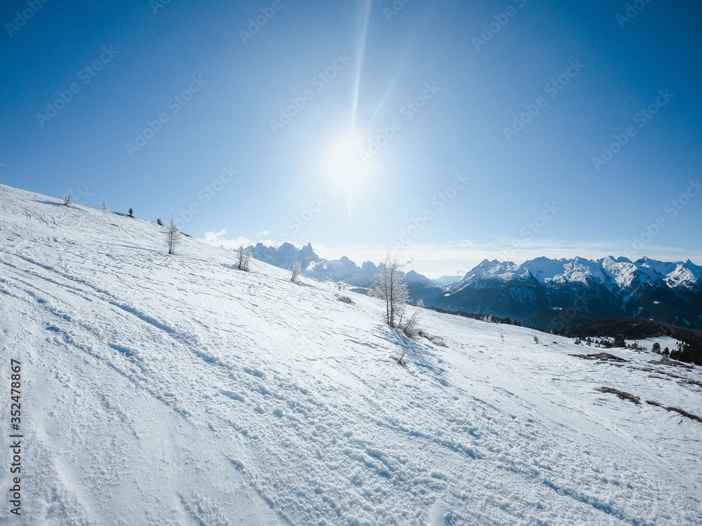 Sunny winter landscape at Ski Area in Dolomites, Italy - Alpe Lusia. Ski resort in val di Fassa near Moena