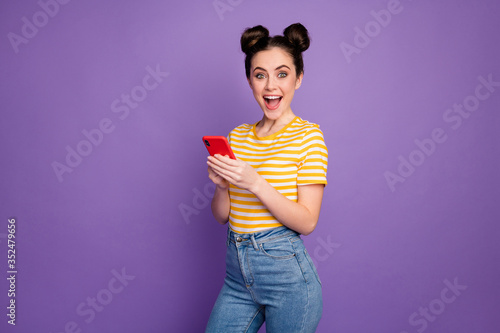 Portrait of her she nice attractive lovely amazed glad cheerful cheery girl using digital device fast speed connection isolated over bright vivid shine vibrant lilac violet purple color background