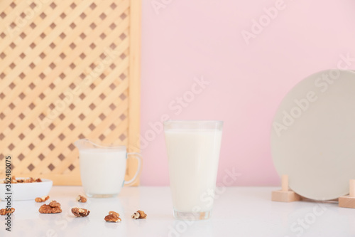 Glass of tasty walnut milk on table © Pixel-Shot