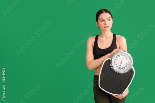 Young woman with measuring ...