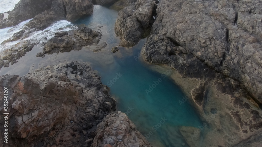 Walking along the coast contemplating the wonders of nature with its mountains,its natural pools and its ocean Walking along the coast contemplating the wonders of nature with its mountains,its natural pools and its ocean
