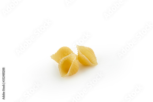 Italian raw dry pasta conchiglie rigate isolated on white background