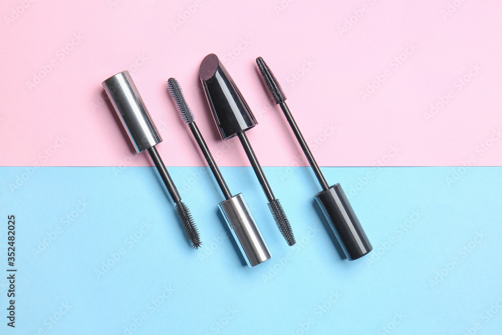 Black mascara on color background Black mascara on color background