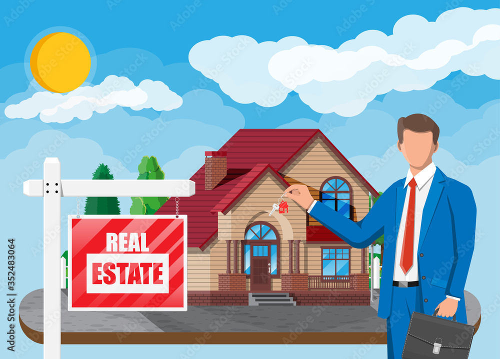 Businessman or realtor near suburban house holding key. Wooden placard ...