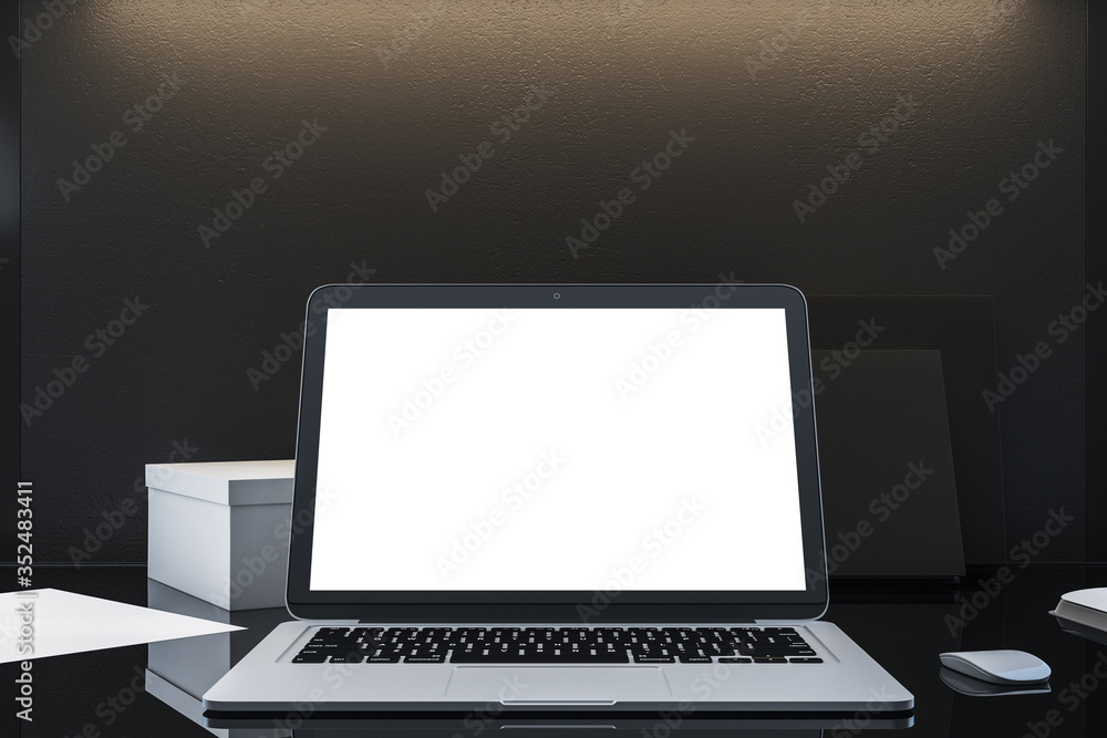 Laptop with empty white screen on office desktop. Laptop with empty white screen on office desktop.