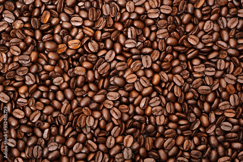 Top view of brown roasted coffee beans  can be use as background  copy space for text.