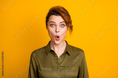 Close-up portrait of her she nice-looking attractive lovely amazed cheerful funny girlish wavy-haired girl sudden new reaction expression isolated on bright vivid shine vibrant yellow color background