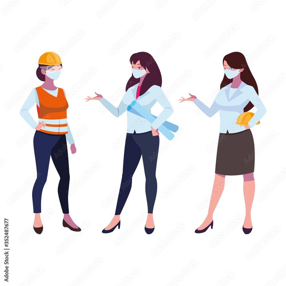 female industrial workers working with face masks female industrial workers working with face masks