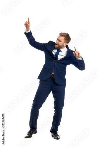 Handsome dancing businessma...