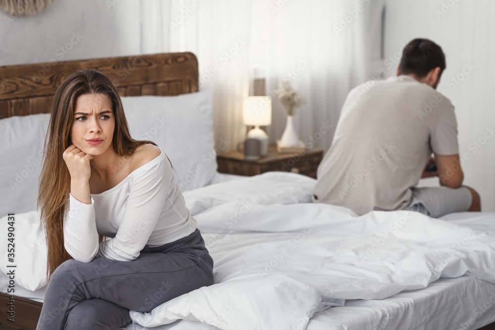 Resentment concept. Girl was offended and turned away from guy Resentment concept. Girl was offended and turned away from guy