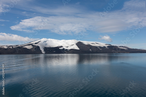 Antarctica landscape with mountains and sea on a cloudy winter day