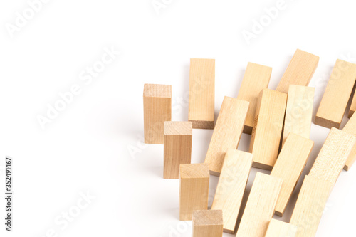 Domino effect  row of wood domino on white background