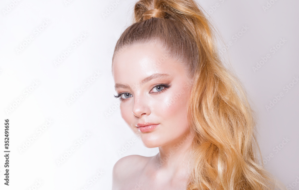 Portrait of a beautiful girl on a light background. Clean healthy skin, radiance. Long eyelashes. Nice smile. Portrait of a beautiful girl on a light background. Clean healthy skin, radiance. Long eyelashes. Nice smile.
