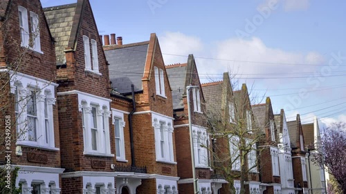 Row of typical British terraced houses- timelapse
