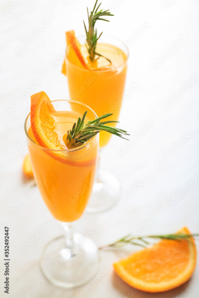 Glasses of tasty mimosa cocktail on table Glasses of tasty mimosa cocktail on table